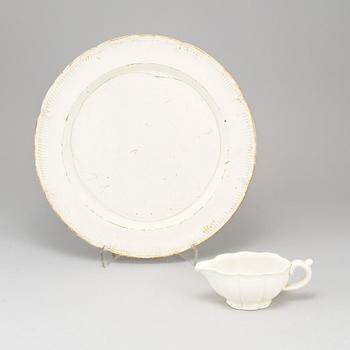 A Swedish Rörstrand creamware dish, end of 18th Century. And a white glazed creamer, probably 18th Century.