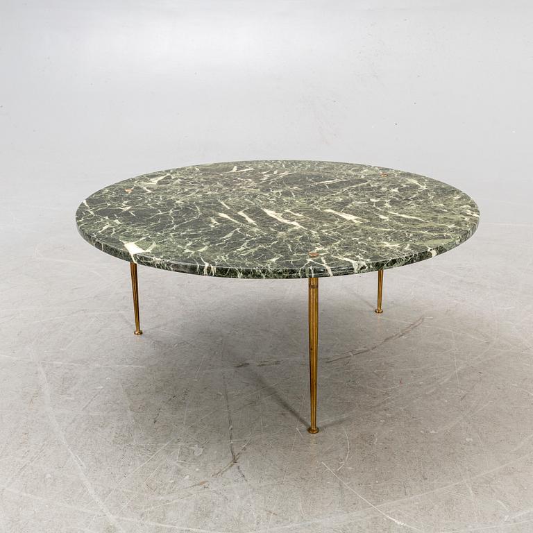 A marble coffee table alter part of the 20th century.