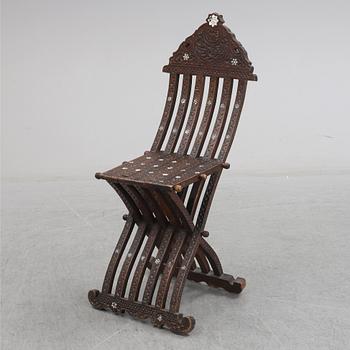 An early 20th century folding chair from the ottoman empire.