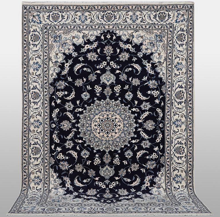A carpet, Nain, part silk, ca 310 x 205 cm.