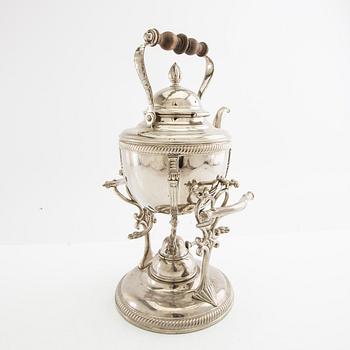 Tea kettle with a burner around 1900.