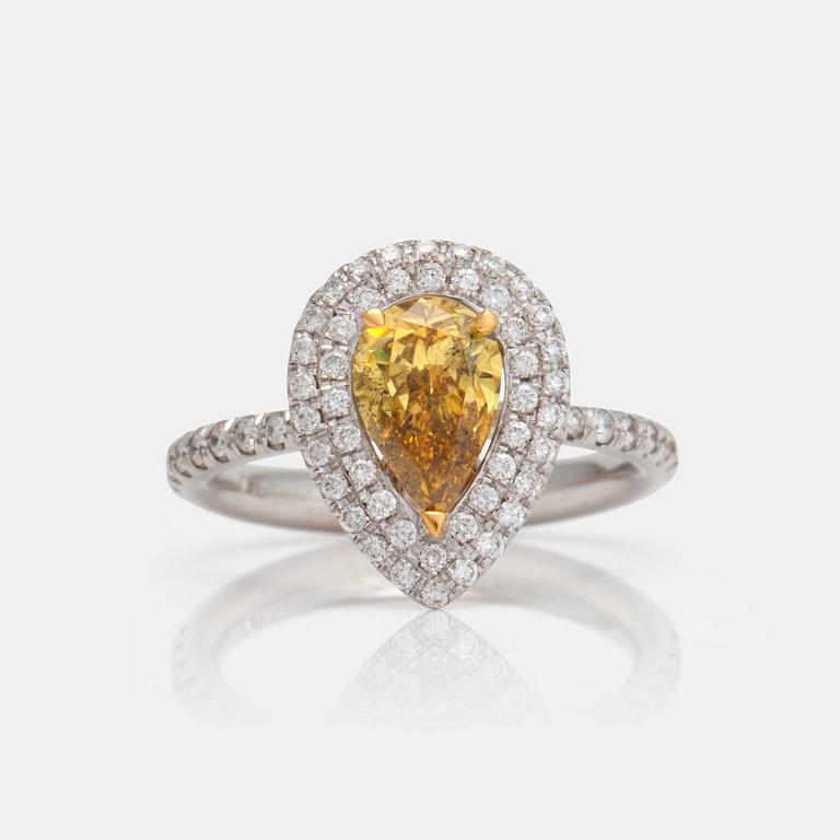 A 1.21ct fancy deep yellow diamond with 0.50ct pavé-set white diamonds in total. GIA certificate.