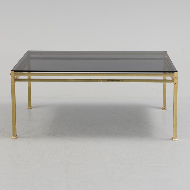 A 20th century brass and glass table.