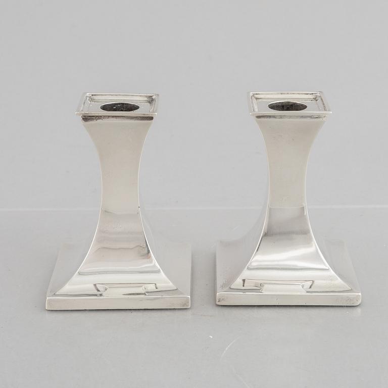 A pair of silver candlesticks, mark of William Hutton & Sons Ltd, Sheffield 1911-1912.