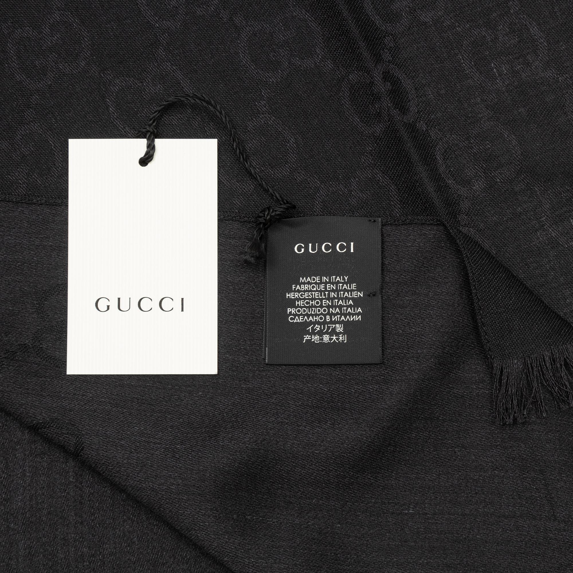 Gucci, a wool and silk mix "GG" jaquard shawl.
