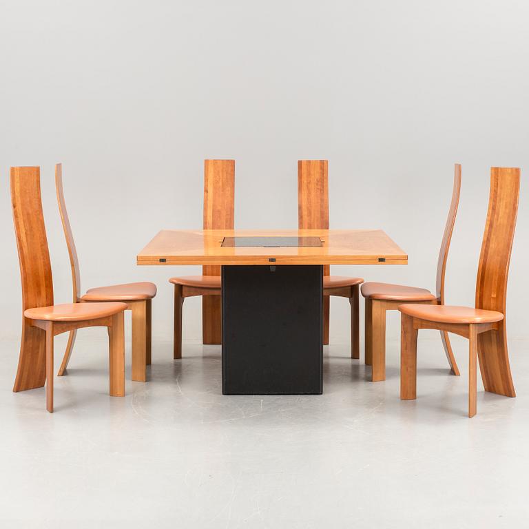 A Bob van den Berghe "Cirkante" table and 6 "Iris" chairs, Van den Berghe-Pauvers, Gent, 21h Century.