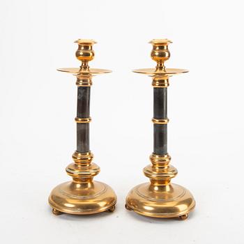 A pair of brass and wood candle sticks early 1900s.