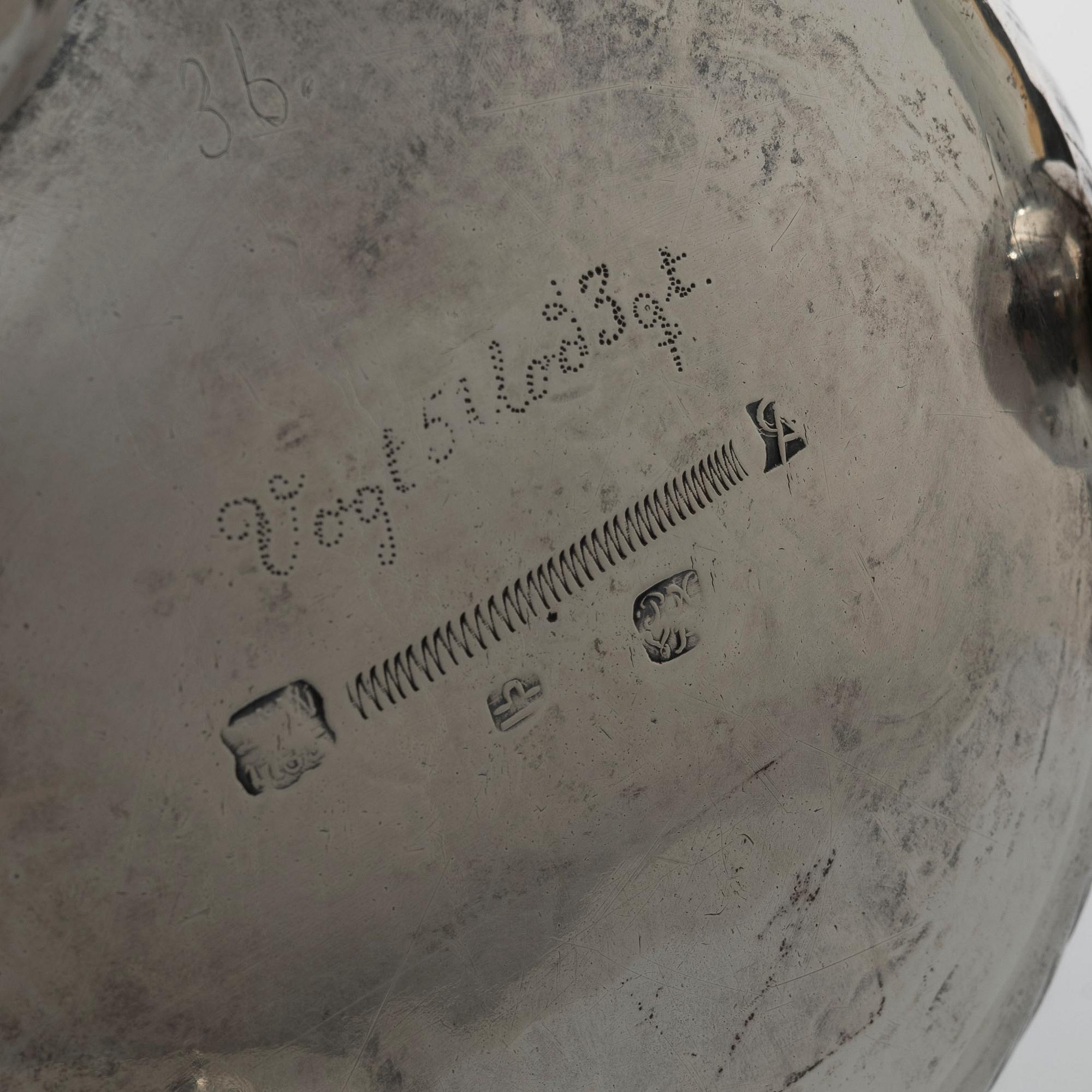 A 19th/20th century silver beaker and cover. Barock style.