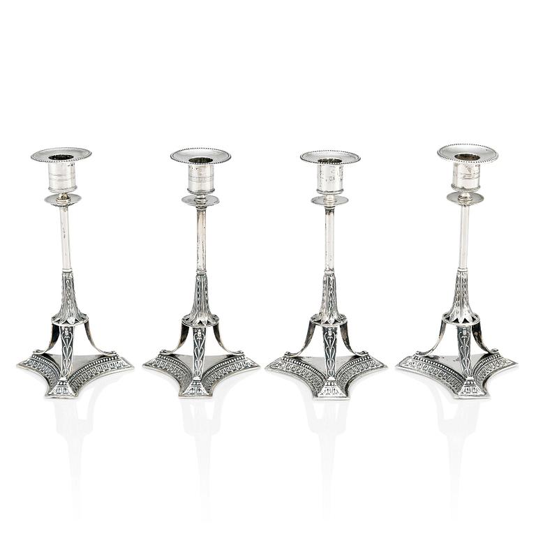 A set of four Swedish early 19th Century silver candlesticks, mark of Adolf Zethelius, Stockholm 1814 and 1818.