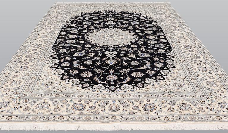 A Nain part silk carpet, 310 x 204 cm.