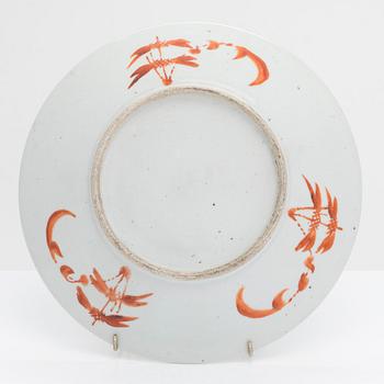 A famille rose dish decorated with a dragon festival moment, late Qing dynasty, China around 1900.