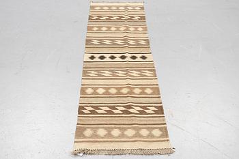 A runner, kilim, ca 240 x 62 cm.