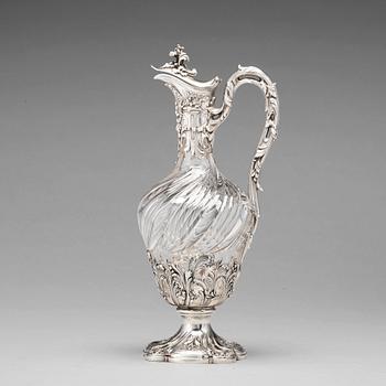 A French mid 19th century parcel-gilt silver and glass wine-jug.