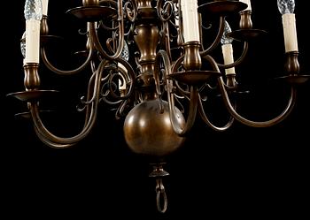 A patinated brass chandelier, first half of the 20th century. Height excl. chain ca 75 cm.
