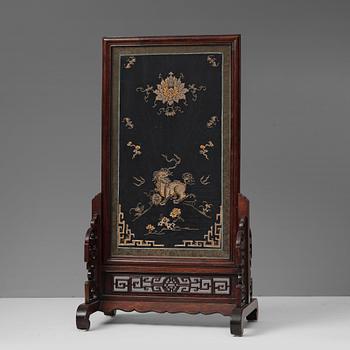679. A large table screen, Qing dynasty, 19th Century.