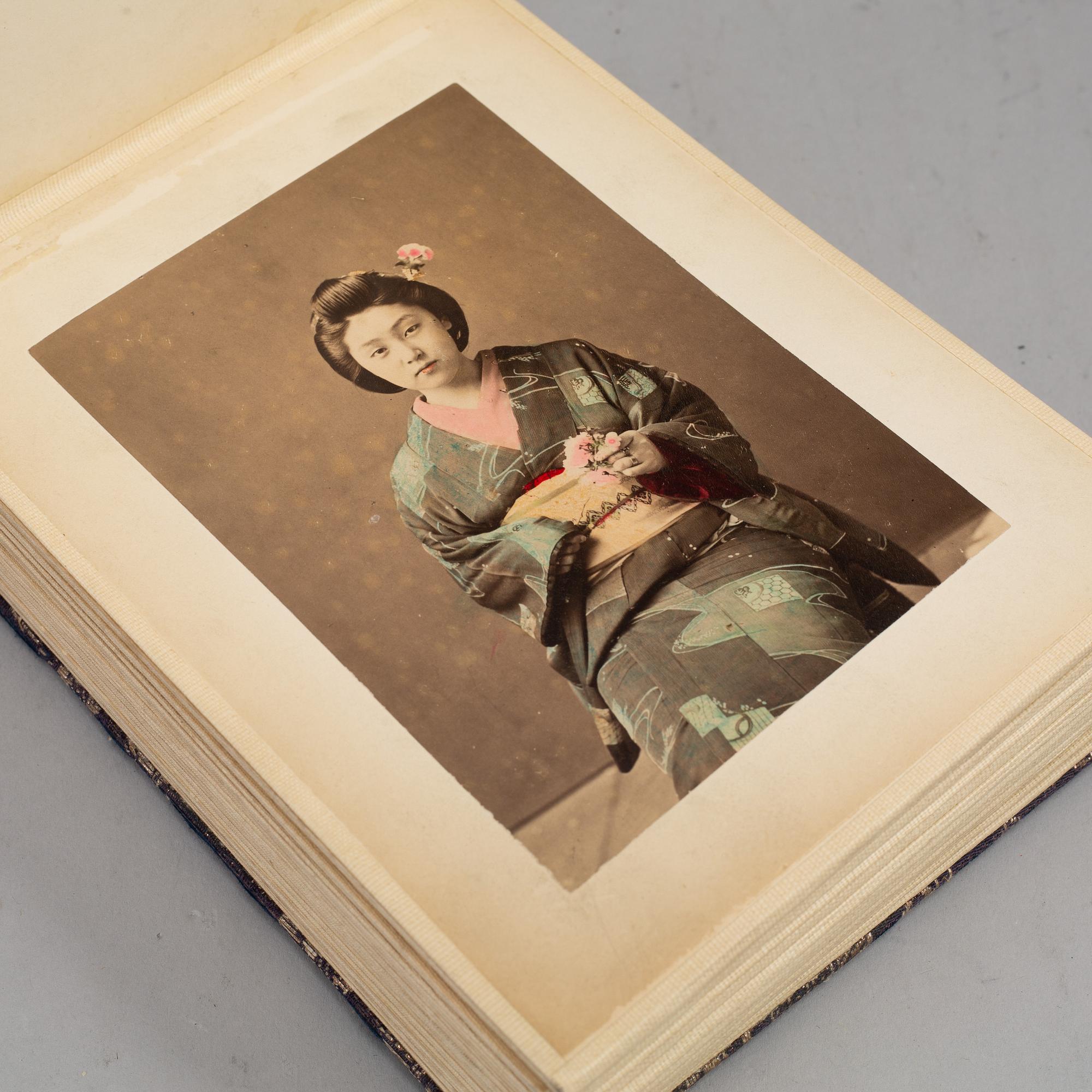 Two signed photographs of the Japanese crown prince and his wife and a photo album.