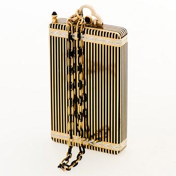 A Cartier Art Deco Vanity Case/Minaudière in 18K gold, black enamel and onyx.