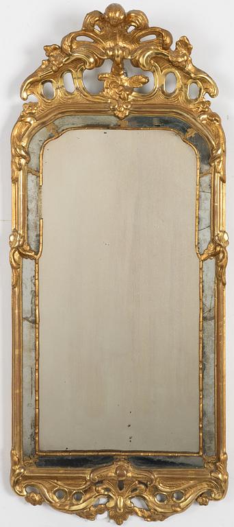 A Swedish giltwood rococo mirror, Stockholm, ltaer part 18th century.