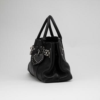 LUELLA BARTLEY, a black leather handbag.