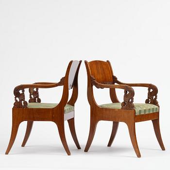 A pair of Baltic / Russian mahogany Empire armchairs, first part 19th century.