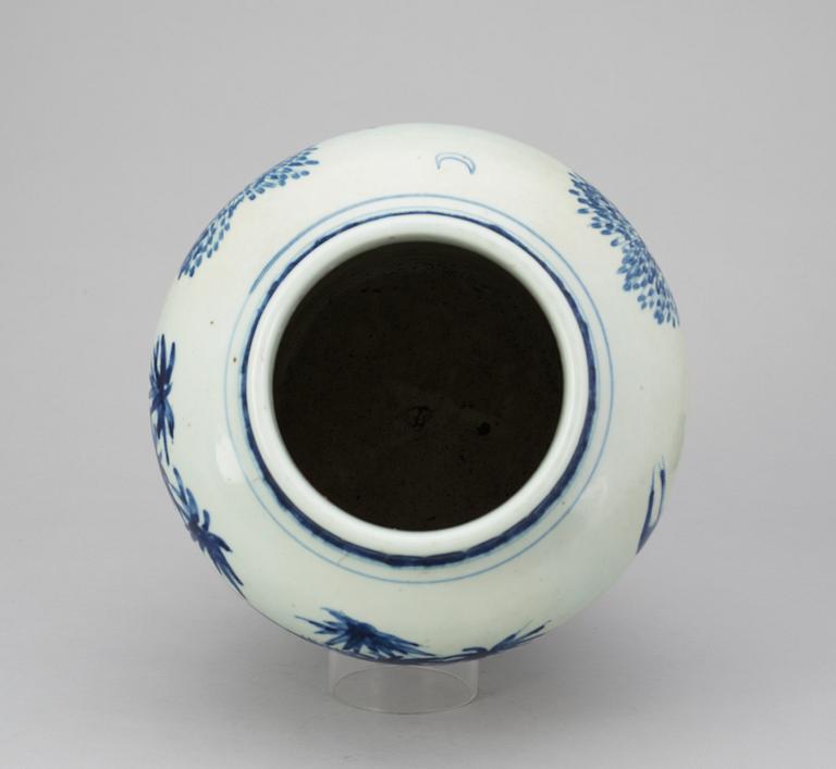 A blue and white Qing dynasty urn.