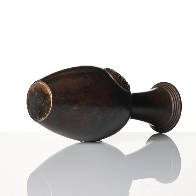 A copper alloy vase, circa 1900.