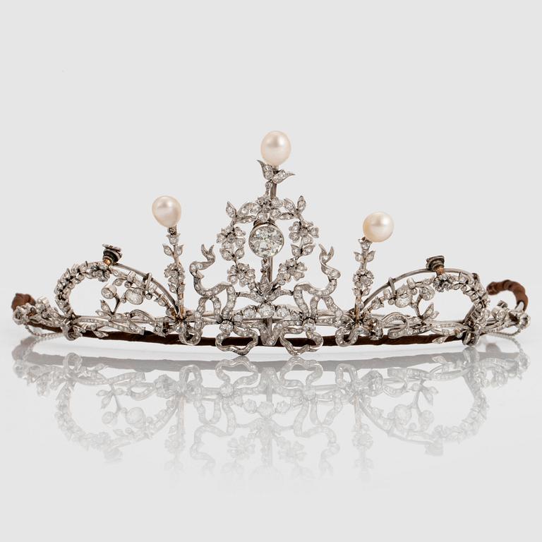 A platinum tiara/necklace combination set with old-cut diamonds and pearls.