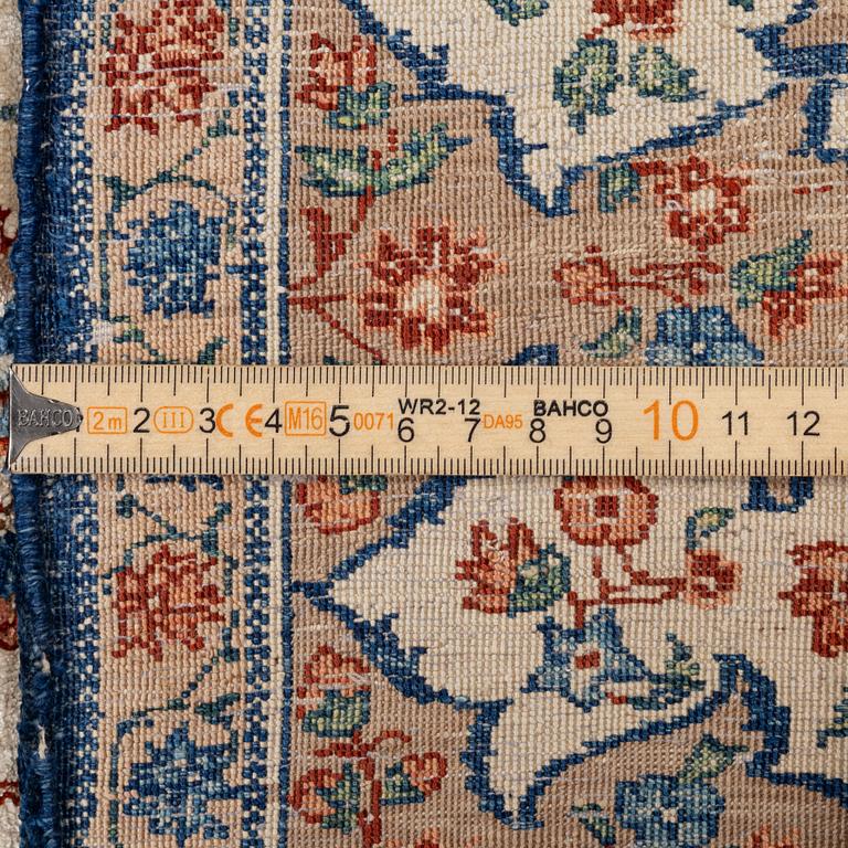 A semi-antique silk Isfahan rug, Central Persia, signed (Sadegh) Seirafian, c. 209 x 142 cm.