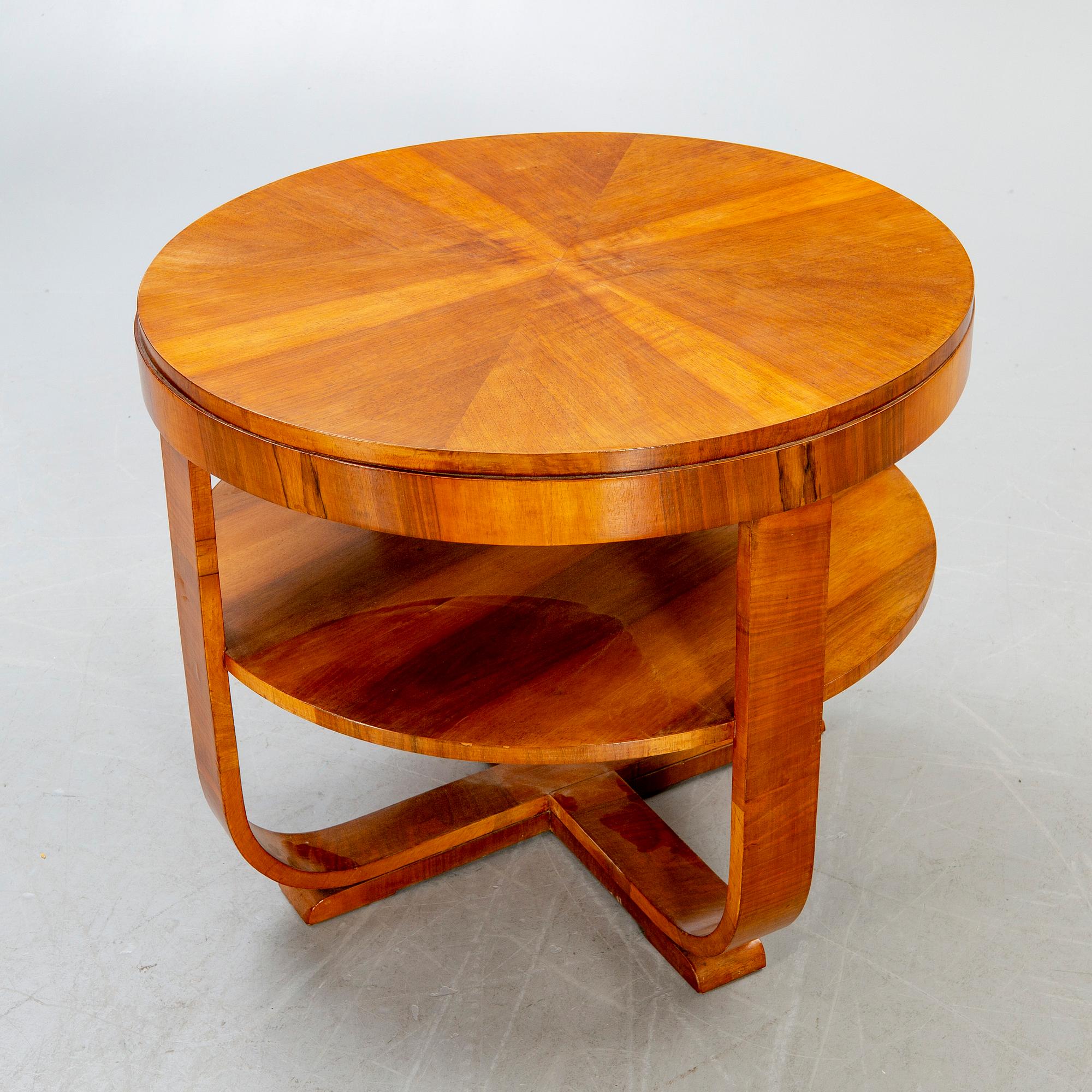 An Art deco style walnut coffee table alter part of the 19th century.