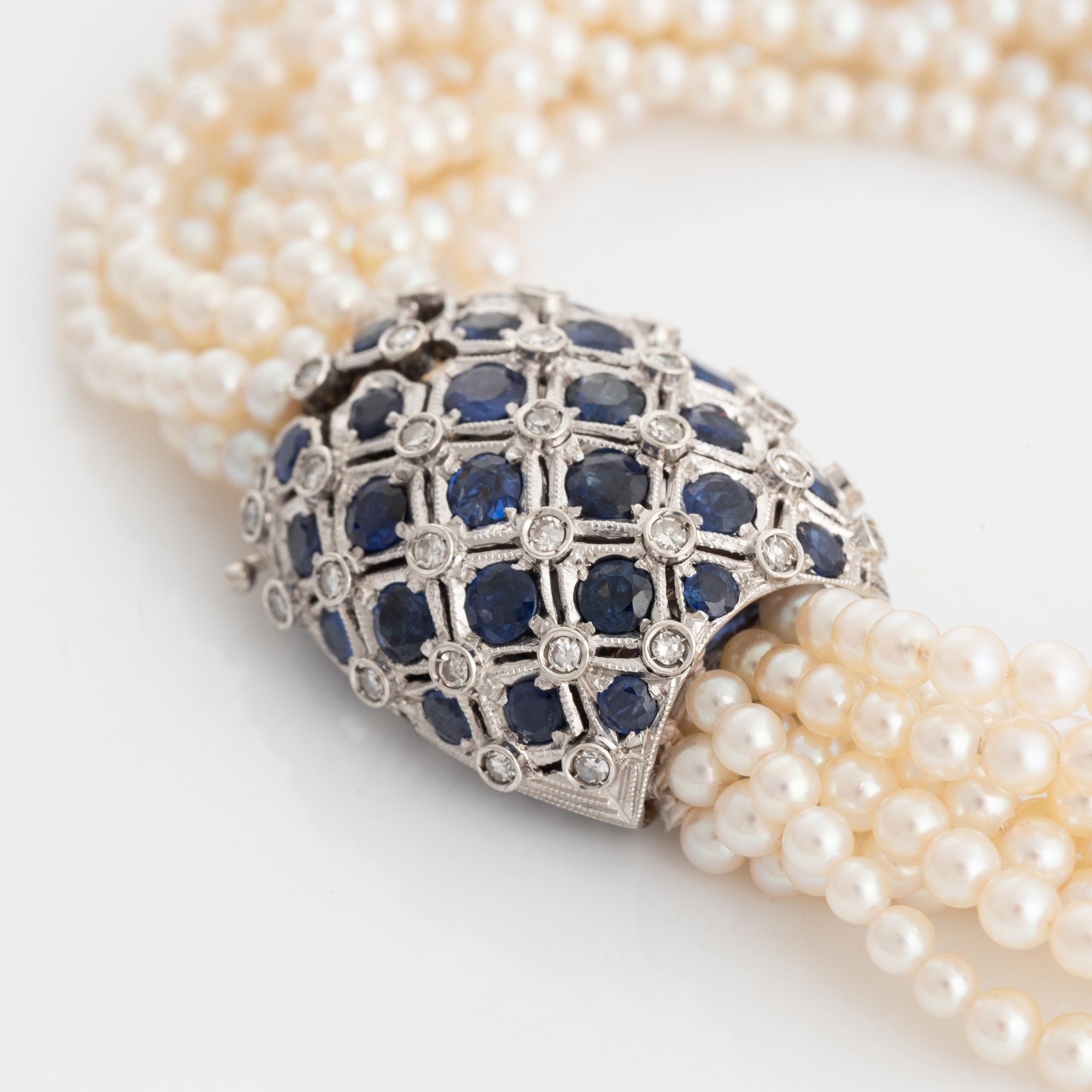 Cultured pearl bracelet, eleven strand, clasp white gold with sapphire and diamonds.