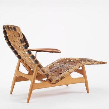 Arne Vodder, a woven leather lounge chair with attached side table, Bovirke, Denmark, 1950s.