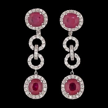 151. A pair of ruby and brilliant cut diamond earrings, total carat weight circa 2.20 cts.