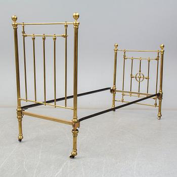 A late 19th or early 20th century bedframe.