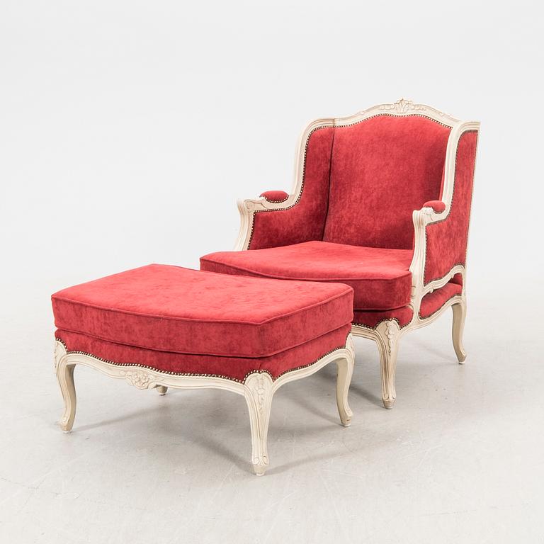 A Louis XV style armchair with stool second part of the 20th century.