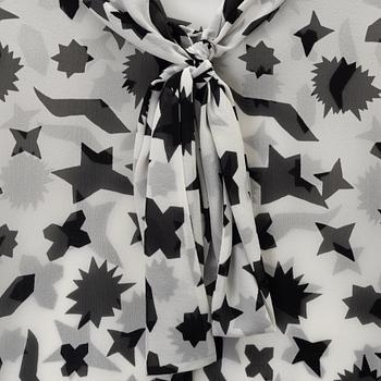 Yves Saint Laurent, a silk blouse, size 36.