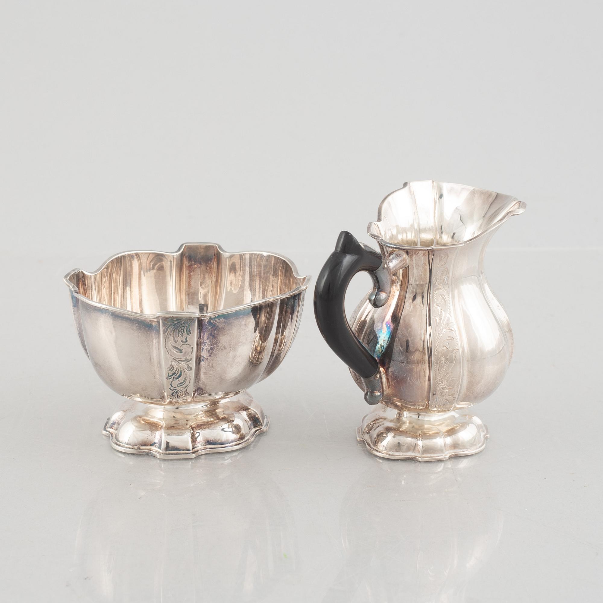 A silver coffee pot, creamer and sugarbowl, Swedish import marks, JL Hultman, circa mid-20th century.