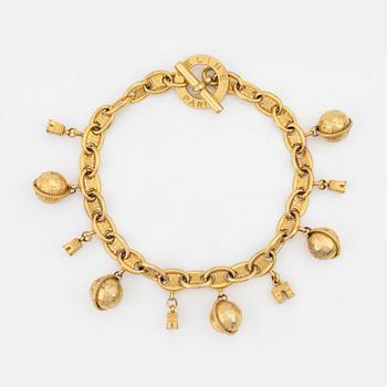 Céline, A gold tone charm necklace.