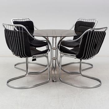 An Italian set of a glass table with four chromed metal chairs, 1970s.