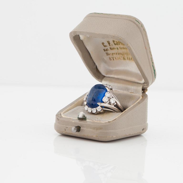 A circa 11.00 ct sapphire and brilliant cut diamond ring. Total carat weight of diamonds circa 1.00 ct.