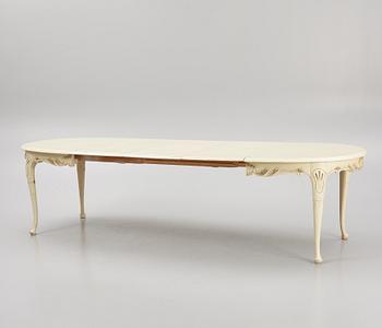 A Rococo style Dining Table with Chairs, first half of the 20th Century.