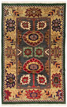 A west Persian carpet of 'Arts and Crafts design', c. 291 x 184 cm.