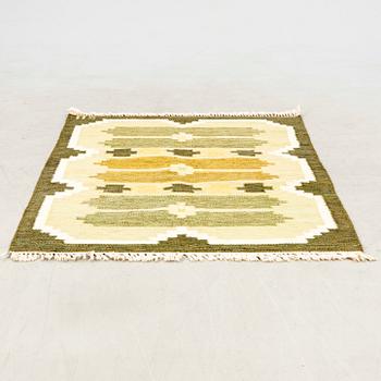 Flat-weave rug signed SH, approximately 194x133 cm.