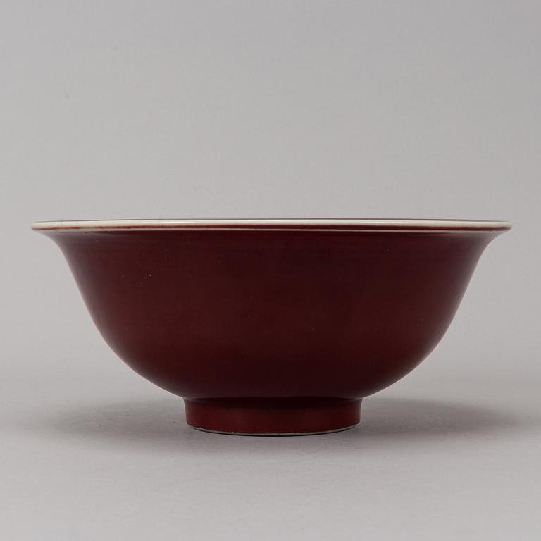 A sang de boef glazed bowl and a ge glazed dish, China, second half of the 20th Century.