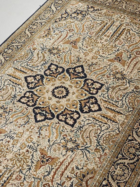 A silk Qum carpet, around  219 x 137 cm.