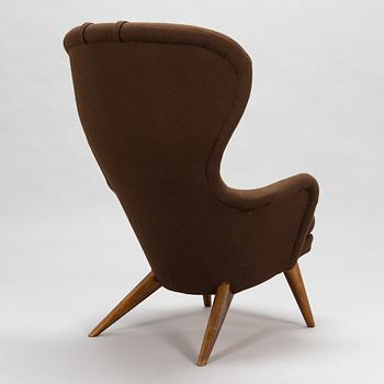 Carl Gustaf Hiort af Ornäs, A mid-20th-century armchair 'Siesta' manufacturer Puunveisto Oy - Träsnideri Ab, Finland.