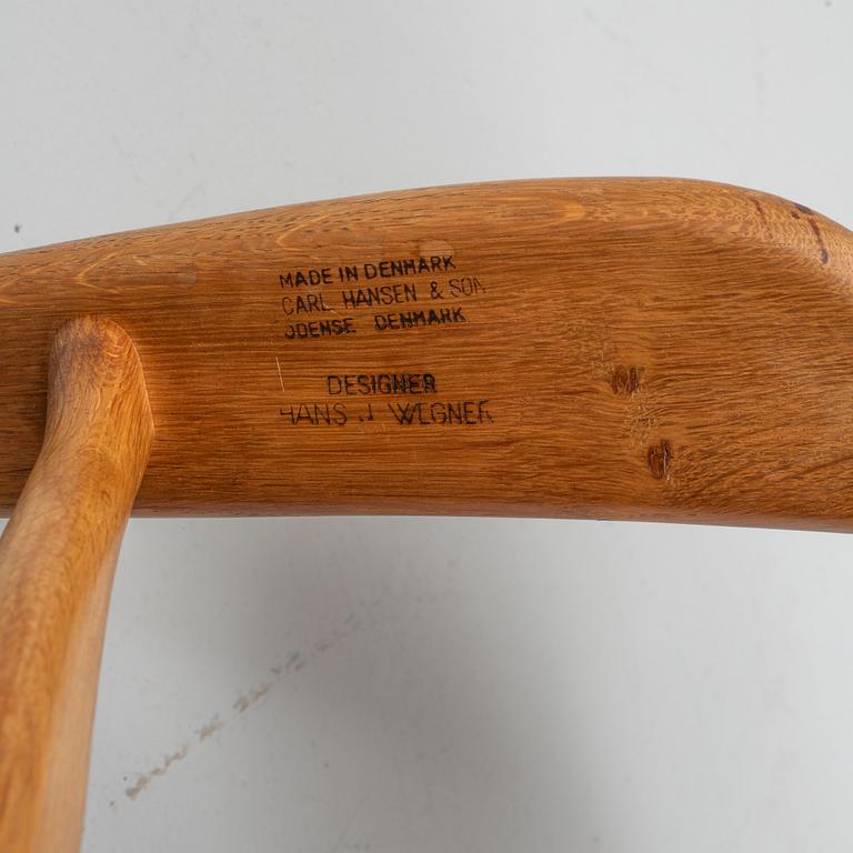 Hans J. Wegner, a model 'CH 22' armchair, Carl Hansen & Son, Odense, Denmark, mid 20th Century.