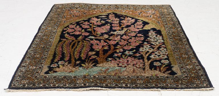 A semi-antique silk Ghom rug, central Iran, c. 32 x 23 in.