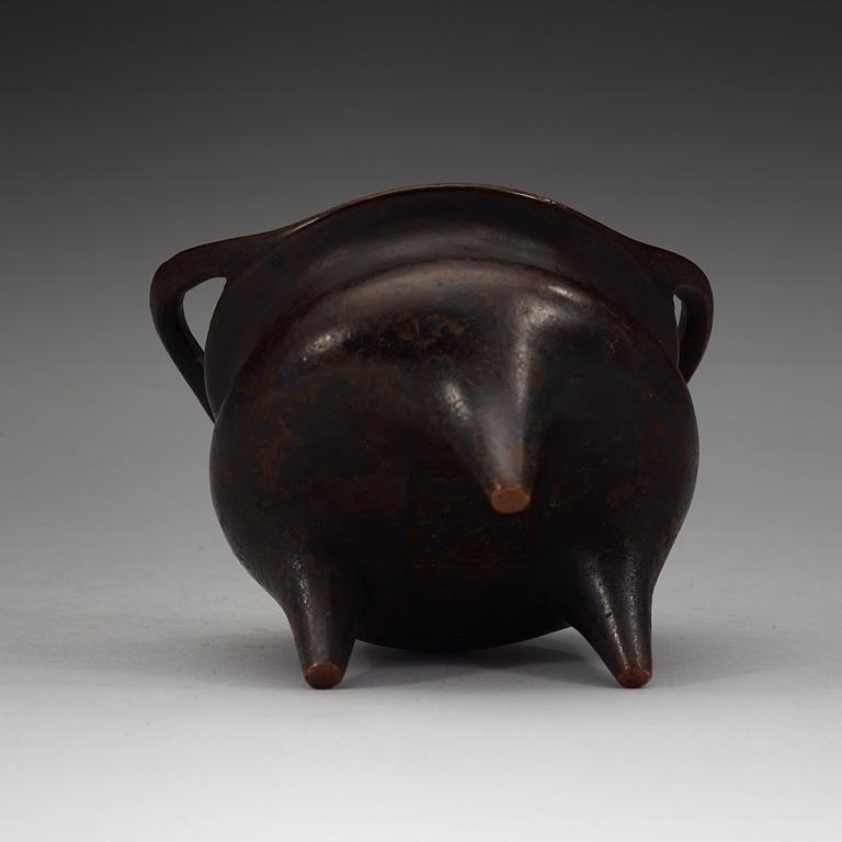 A copper alloy tripod censer, Ming dynasty, 17th Century with Xuandes four character mark.