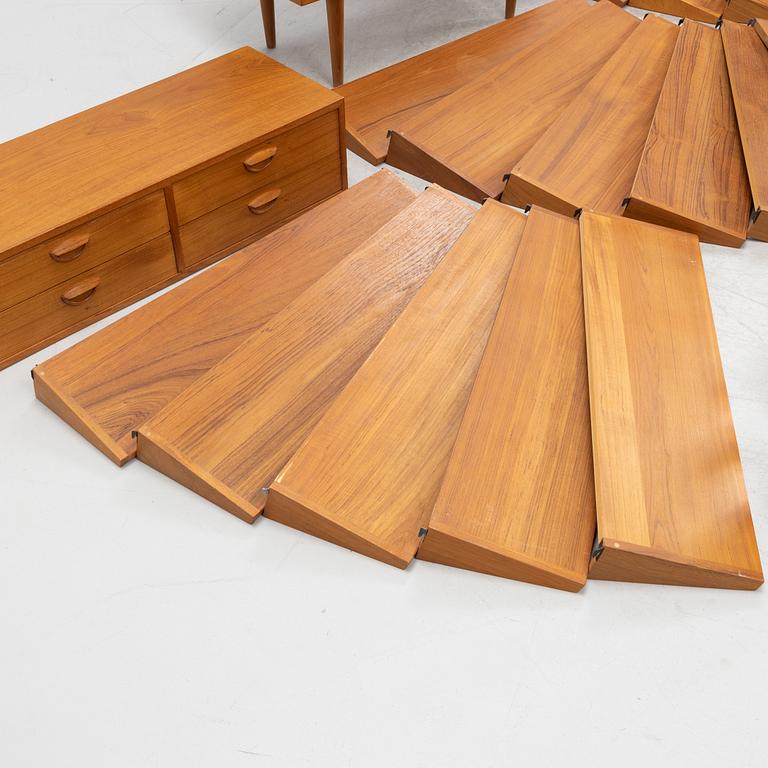 A teak and teak veneered shelf system, mid 20th century.