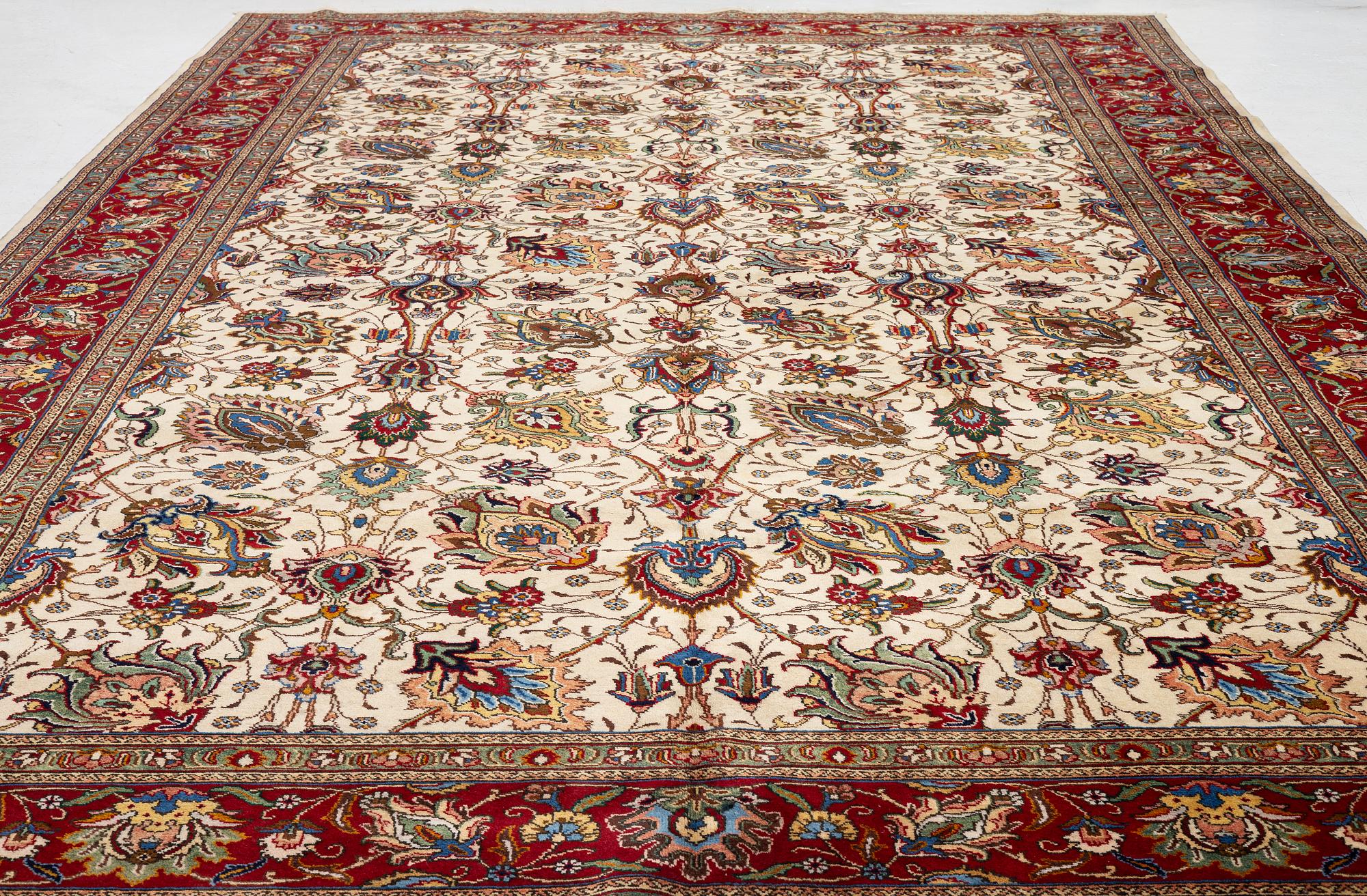 A Tabriz carpet, Northwestern Iran, of Safavid 'palmette' design, c, 483 x 302 cm.